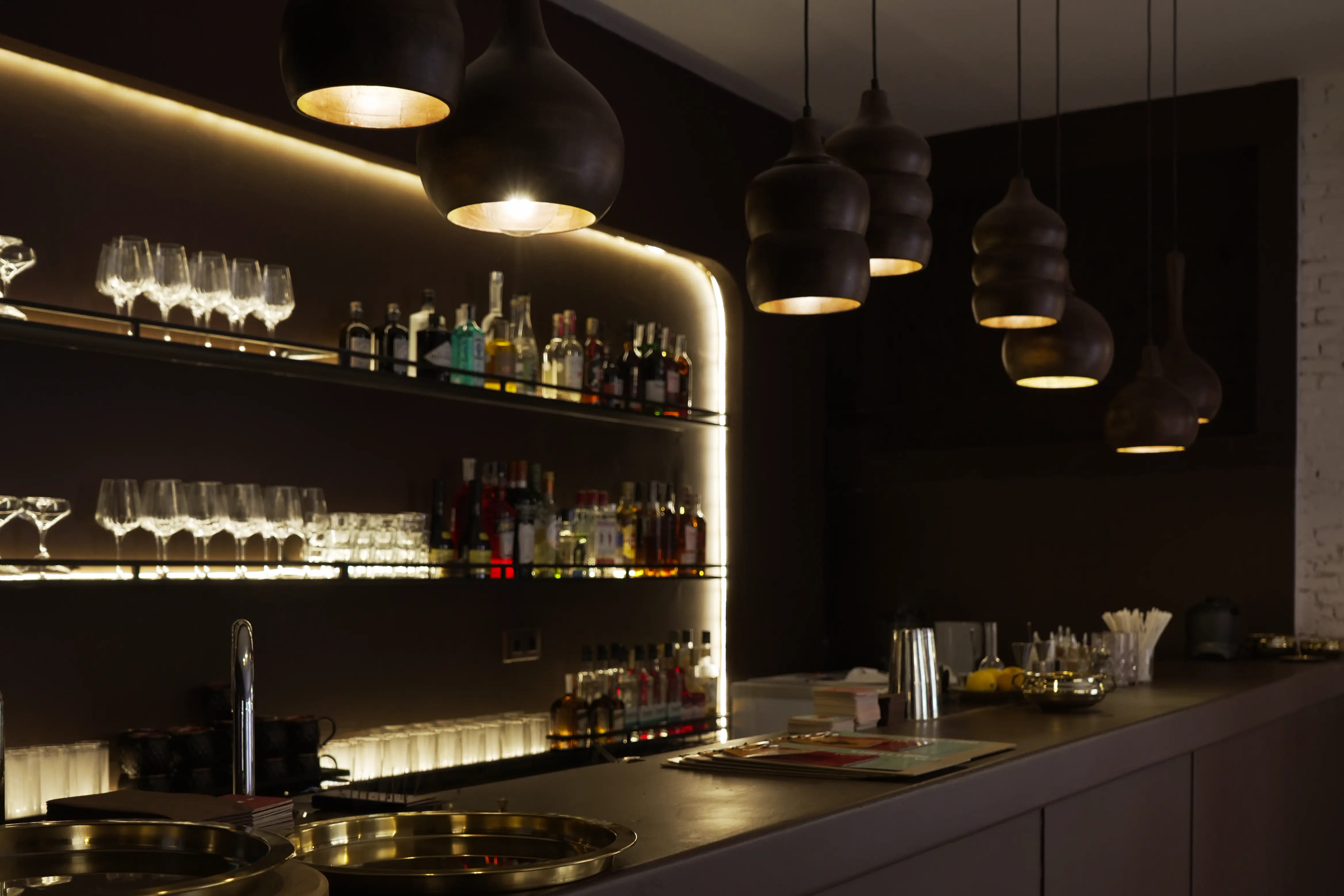 RASA Bar ambience with cocktails on a golden tray